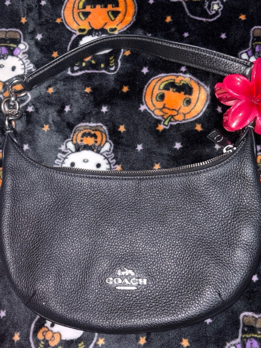 COACH Black Pebbled Leather Shoulder Bag with Pink Flower Charm